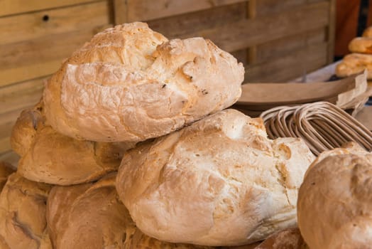 Rustic bread loaves on a market stall, Badajoz
