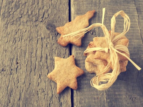 Sweet organic homemade cookies on an old rustic kitchen table, vintage color stylized, view from above