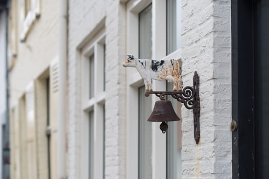 old vintage antique door bell with cow on it