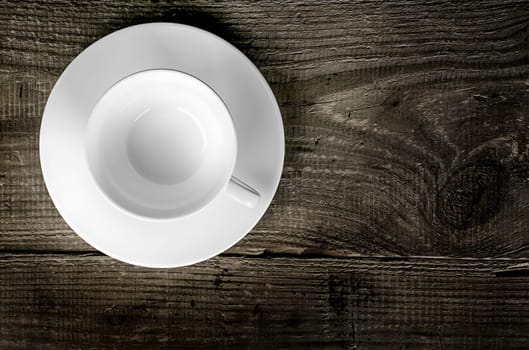 Empty coffee cup on wooden table top view