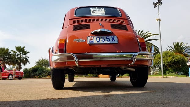 Menton, France - September 9, 2017: Old Red Fiat 500 L (Rear View) Parked on the Esplanade Francis Palmero in the City of Menton on the French Riviera