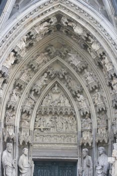 an arch-shaped entrance to the church with saints