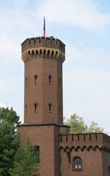 a tower built of red brick stones
