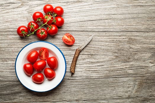 Fresh tomatoes on wooden background. Top view