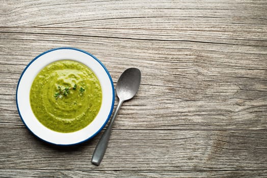 Fresh healthy vegetable green soup overhead shoot