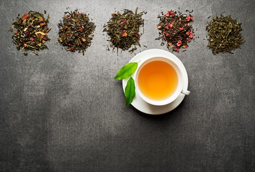 Cup of tea with dry tea collection of different types