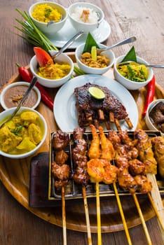 Traditional balinese sea food with satay and curry in Bali, Indonesia