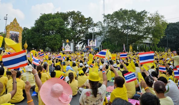 BANGKOK, THAILAND - DECEMBER 5: Thai people gather in the street to pay respect to King Bhumibol on his 85 th birthday celebration on December 5, 2012 in Bangkok, Thailand.