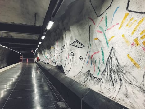 STOCKHOLM, SWEDEN - JUNE 10, 2017: Hallonbergen tunnelbanestation Underground. Station on blue line of the metro with kids paintings, doodles, characters
