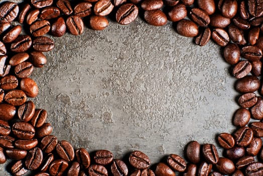 Coffee beans on a gray background close up