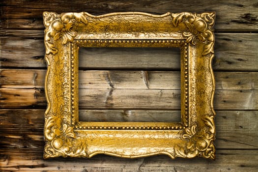 Big Old Gold Picture Frame on wooden background