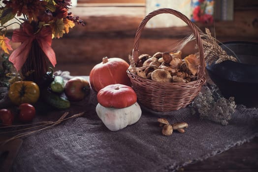 Still life from autumn nature gifts. mushrooms and vegetables