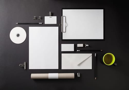 Blank stationery set on black background. Template for branding identity for designers. Top view.