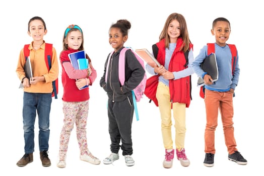 Group of school children posing isolated in white