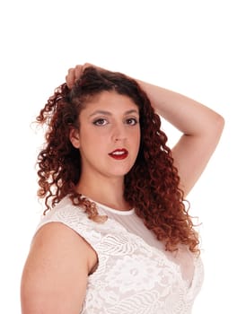 A beautiful woman in a beige lace dress standing with one hand on.her head in profile waist up, isolated for white background.