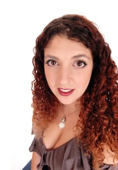 A closeup portrait of a beautiful woman with curly brunette.hair, isolated for white background.