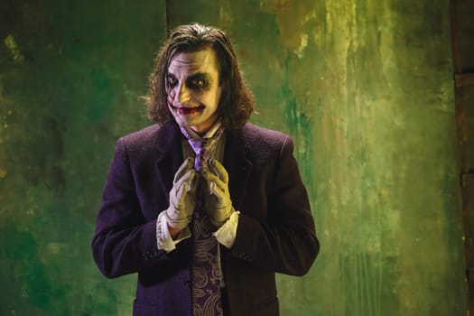 Bloody Halloween theme: The crazy maniak face on dark studio background