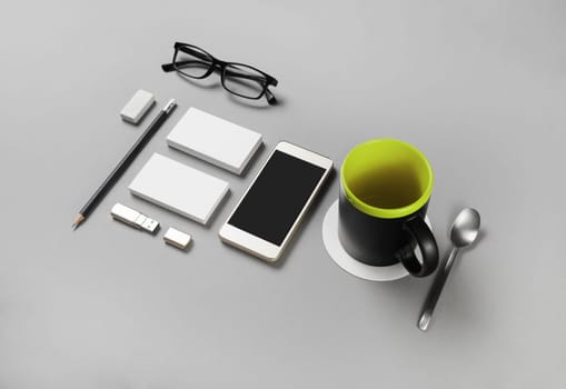 Photo of blank corporate identity. Stationery set on gray paper background. Branding mockup.