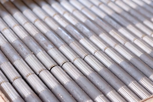 tubes with threaded threads. in production. finished parts in a row.