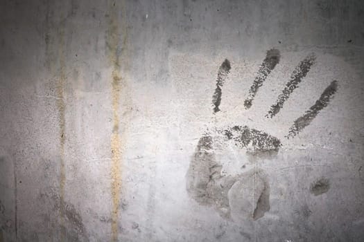 Grungy wall with hand print. It can be used as a backdrop, grungy wallpaper, design t-shirts and more. Fully editable.