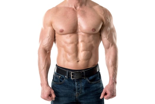 Power athletic man with great physique. Strong bodybuilder showing perfect body isolated in white.