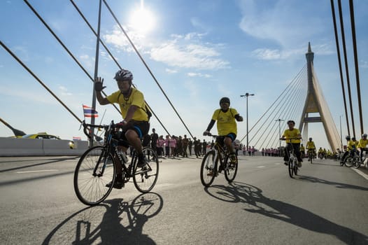 BANGKOK, THAILAND - DECEMBER 14, 2014 : "Bike for the King"", Thai event pay respect to King Bhumibol on his 87 th birthday celebration by participant cycling at Bhumibol bridge in Bangkok, Thailand"