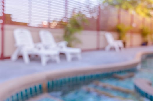 Abstract blurred image of outdoor swimming pool for background. Vintage filtered effect image