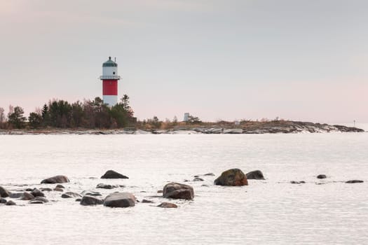 Light House in Holmsund, Sweden with a cloudy sky.