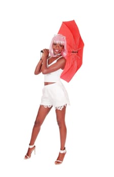A beautiful African woman in white shorts and high heels standing.with a red umbrella, isolated for white background.