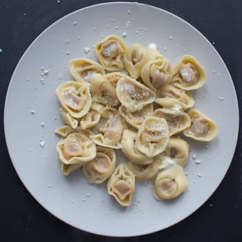 tortellini with cheese sauce and butter,top view