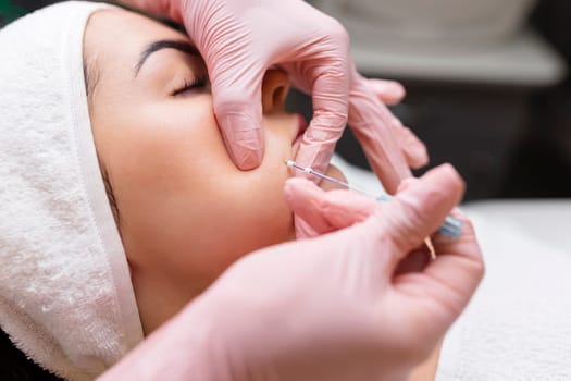 Face lifting PDO Suture operation. innovative technique of New thread lift, cosmetologist preparing to do procedure to female client, select the appropriate thread option.