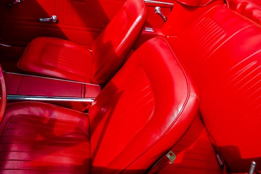 BAD NAUHEIM,GERMANY AUGUST 2017: Restored bright red leather seats of a classic car at the 16th European Elvis Festival in Bad Nauheim,Hesse.