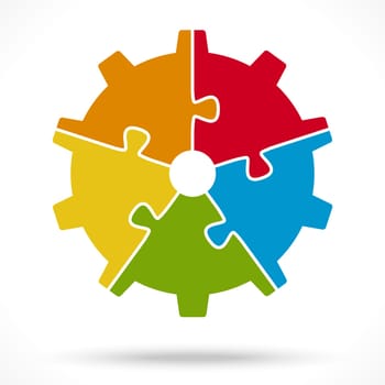 gear wheel with five colored puzzle parts for cooperation or teamwork symbolism