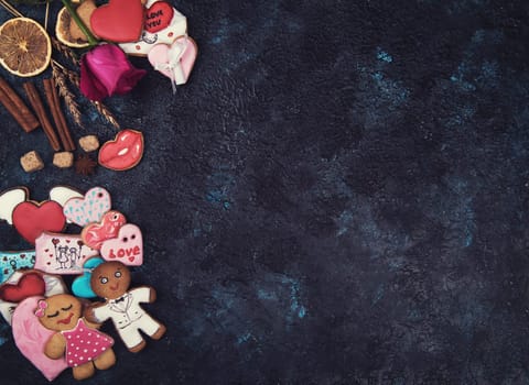 Gingerbreads for love or marrige on dark concrete background