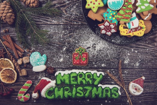 Homemade ginger cookies for new years and christmas on wooden background, xmas theme