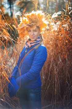 Beauty woman at autumn park in sunny beauty day