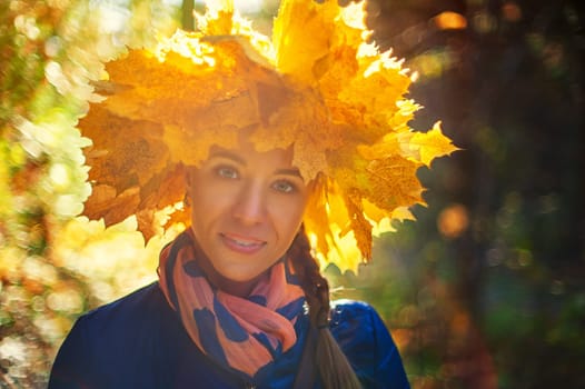 Beauty woman at autumn park in sunny beauty day