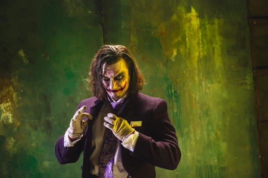 Bloody Halloween theme: The crazy maniak face on dark studio background