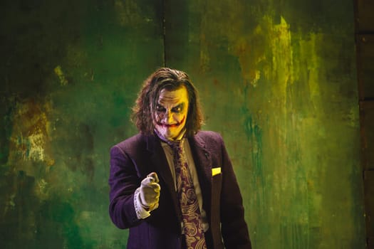 Bloody Halloween theme: The crazy maniak face on dark studio background