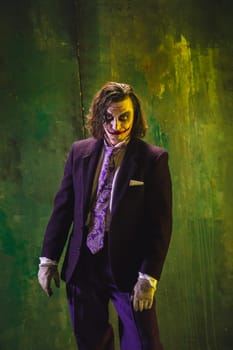 Bloody Halloween theme: The crazy maniak face on dark studio background