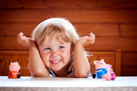 little girl with her toys having fun with her toys