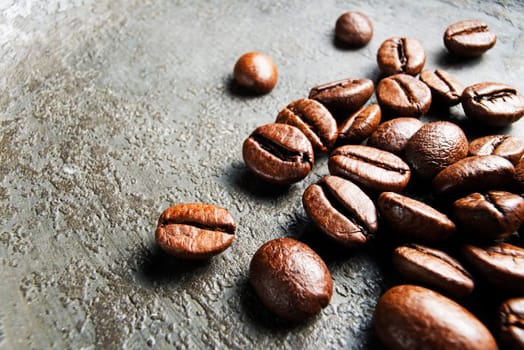Coffee beans on a gray background close up
