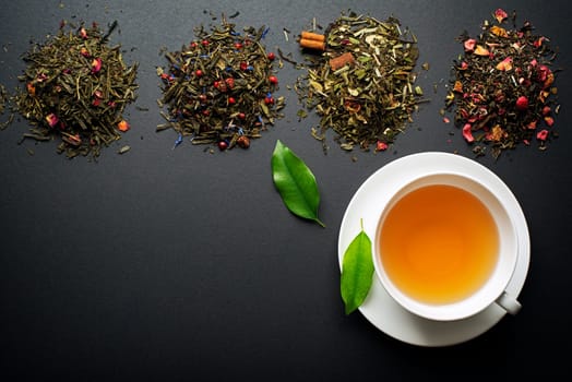 Cup of tea with dry tea collection of different types