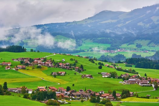 Aerial View on Obermaiselstein in the Fog. Oberallgau, Germany