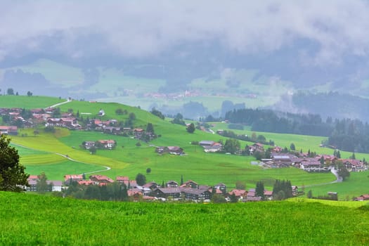 Aerial View on Obermaiselstein in the Fog. Oberallgau, Germany