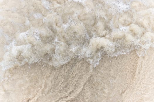 Closeup of sand pattern of a beach in the summer