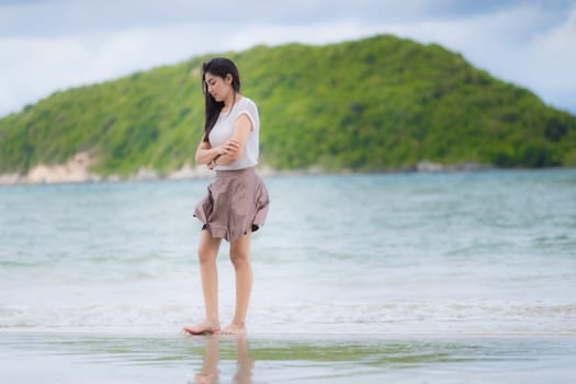Beautiful Asian woman vacation on beach of Thailand.