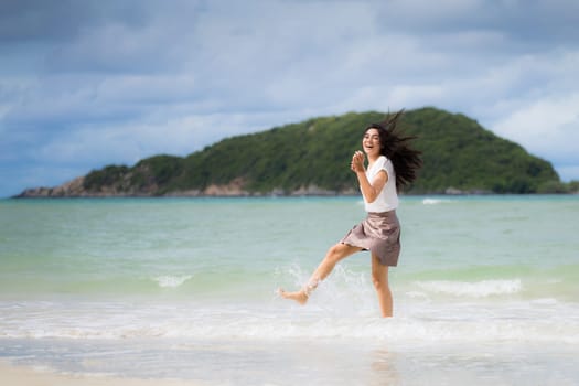 Beautiful Asian woman vacation on beach of Thailand.