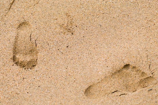 Closeup of sand pattern of a beach in the summer