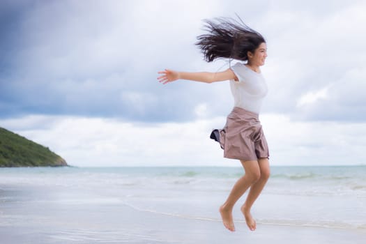 Beautiful Asian woman vacation on beach of Thailand.
